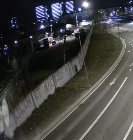 Russian agents paint graffiti on the fence of the NATO Cyber Defence Centre in Tallinn (screenshot from CCTV)